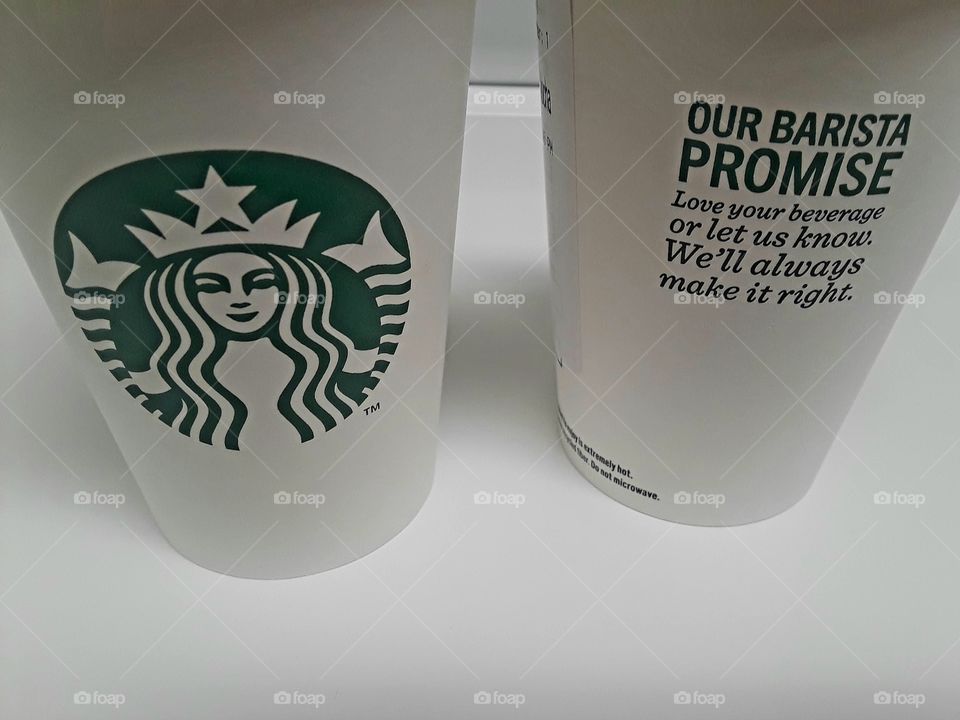 Two Starbucks Cups Side By Side Motto