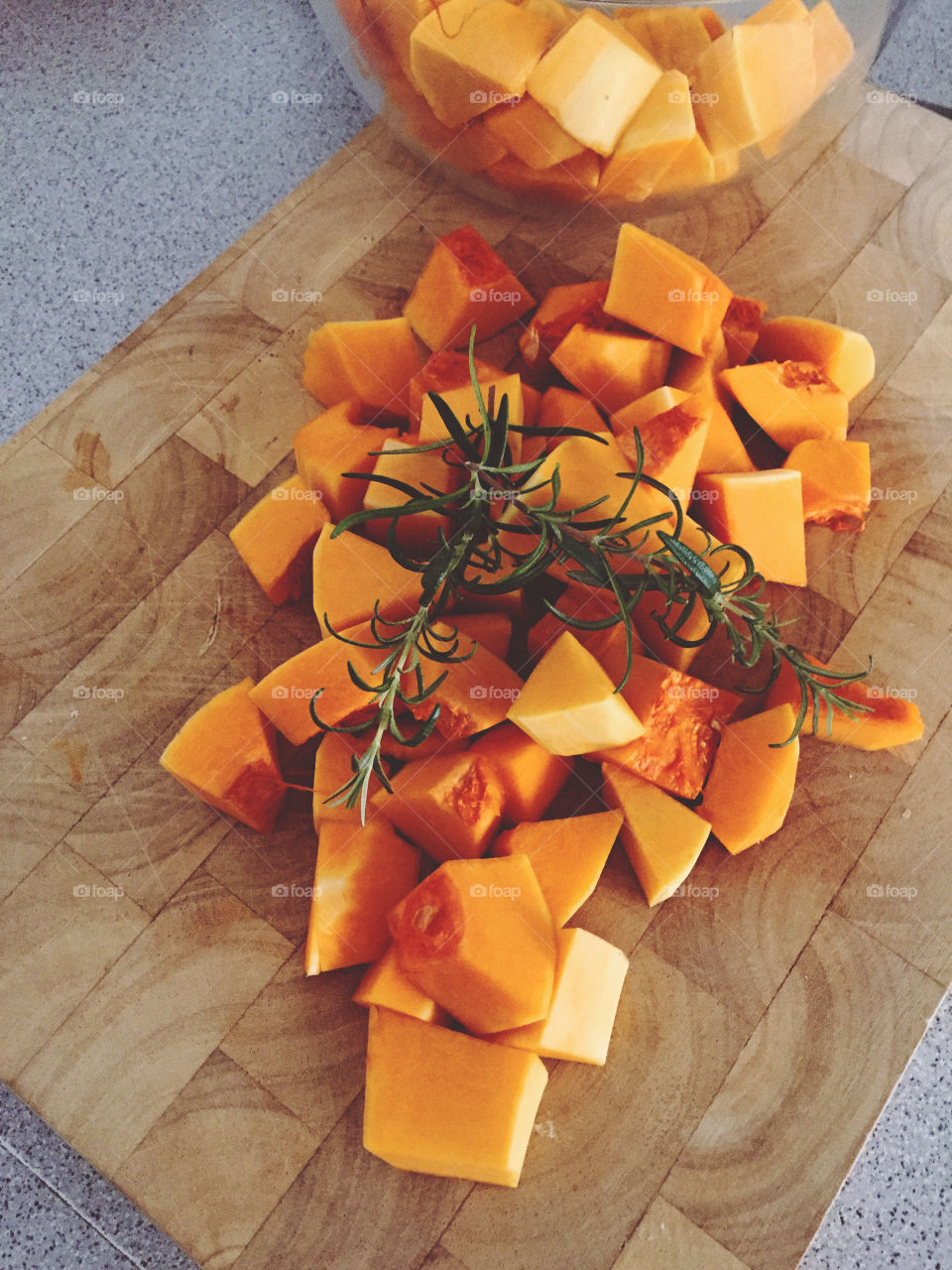 Butternut squad cut in cubes and rosemary 