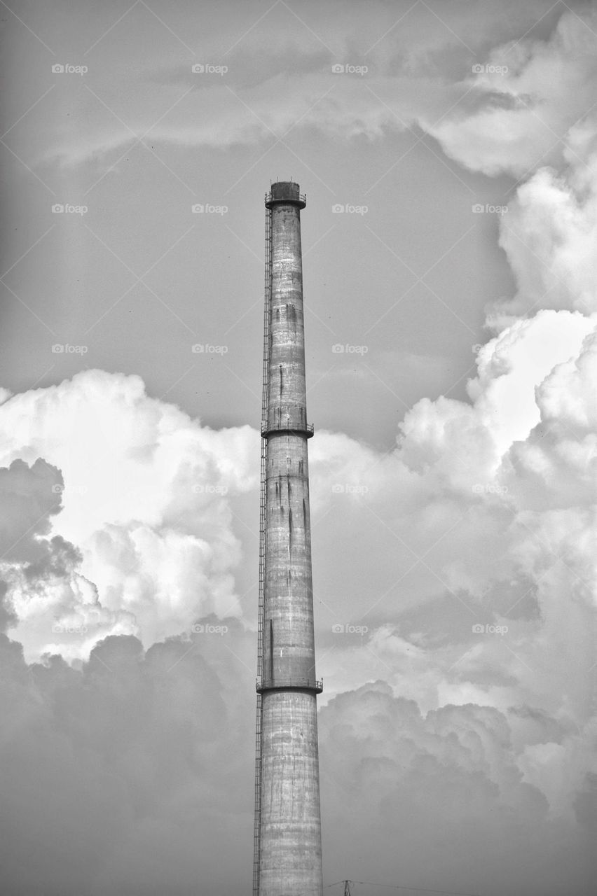 a long chimney with cloudy background.