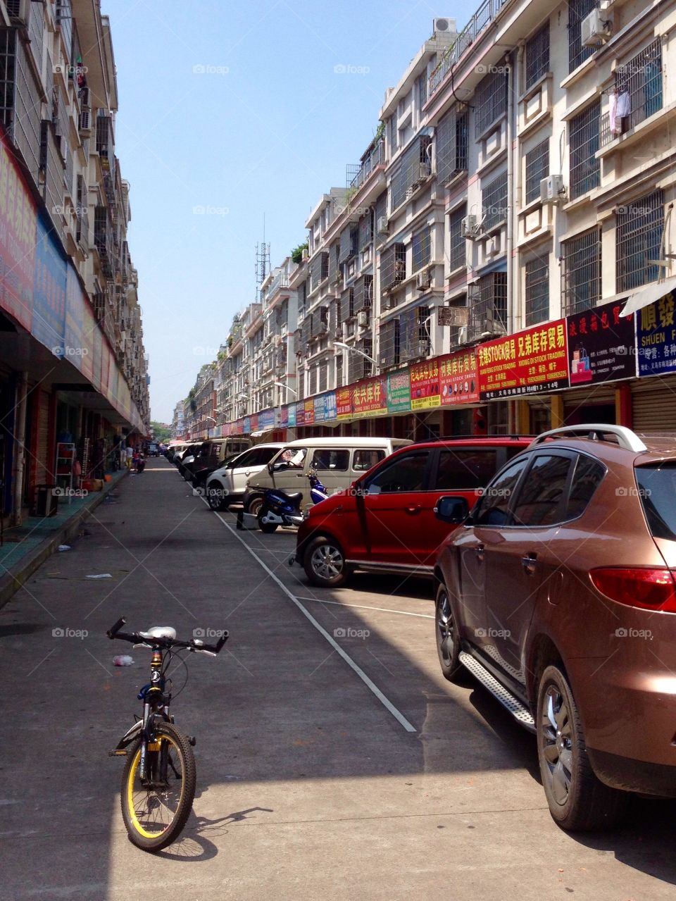 A street with apartments and parked cars in Yiwu, China