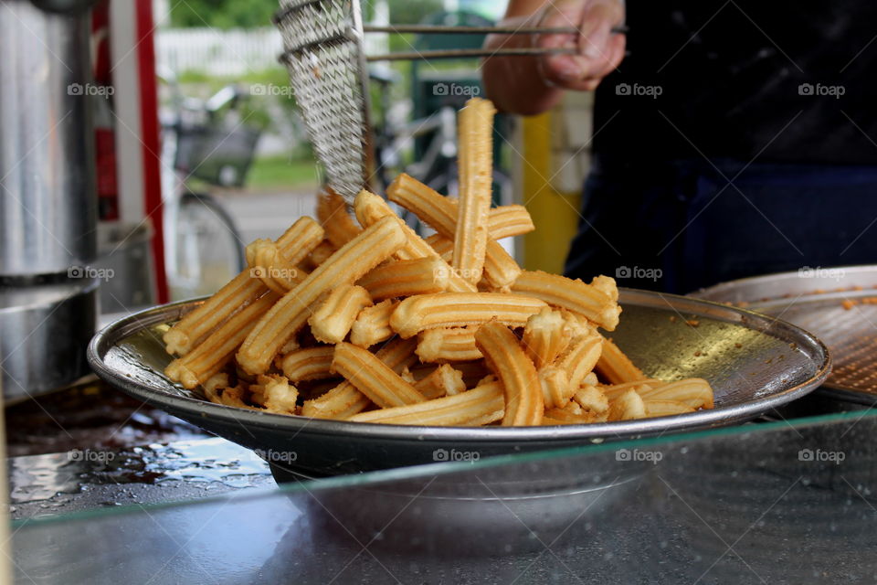 Street food churro by the food truck