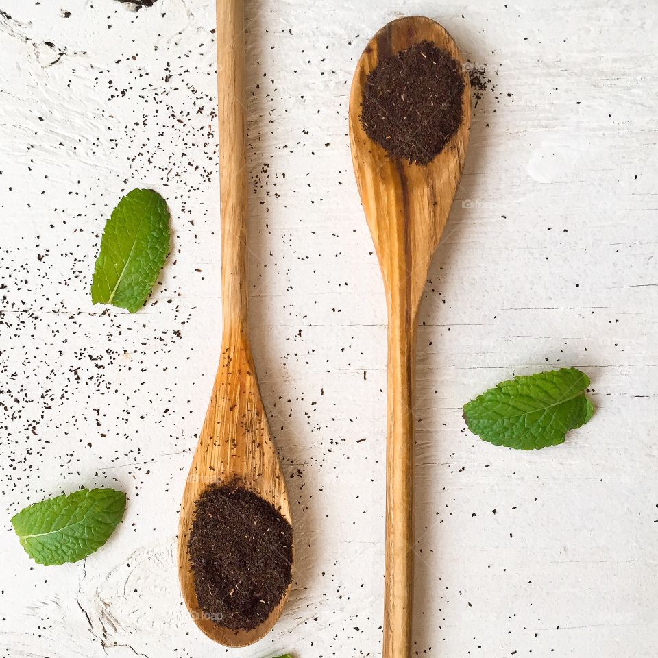 Tea leaves in wooden spoons