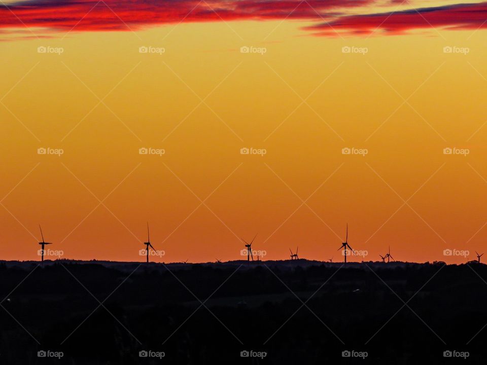 Windmills in sunset