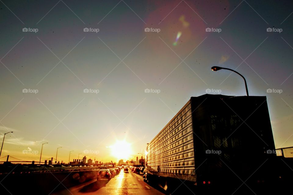 highway trucks sunset