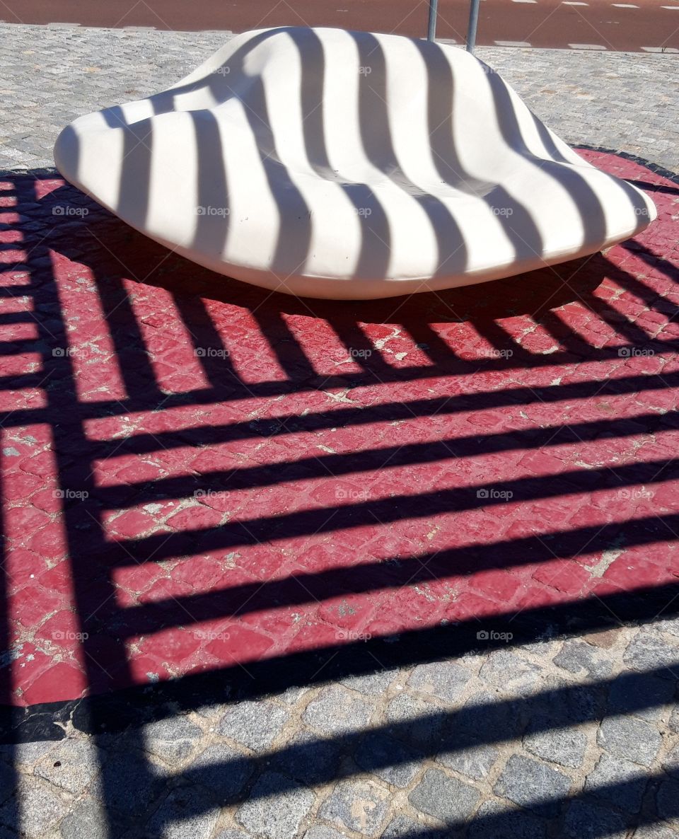 shadow on bench in Cascais