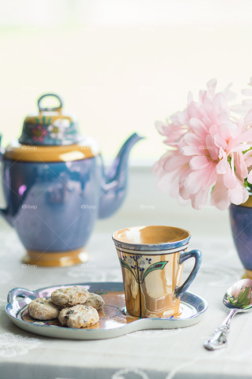 Tea and cookies with flowers