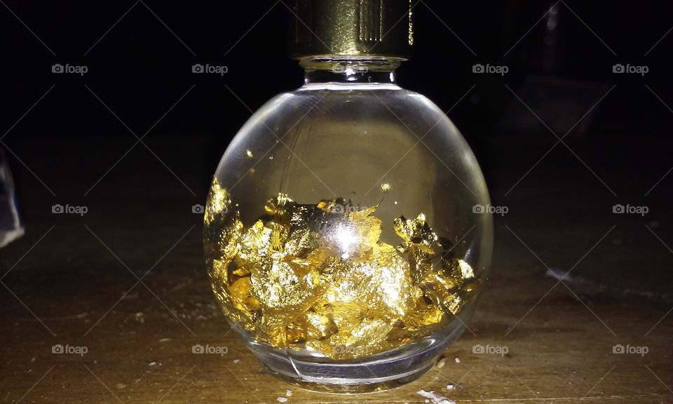 gold flakes in a bottle