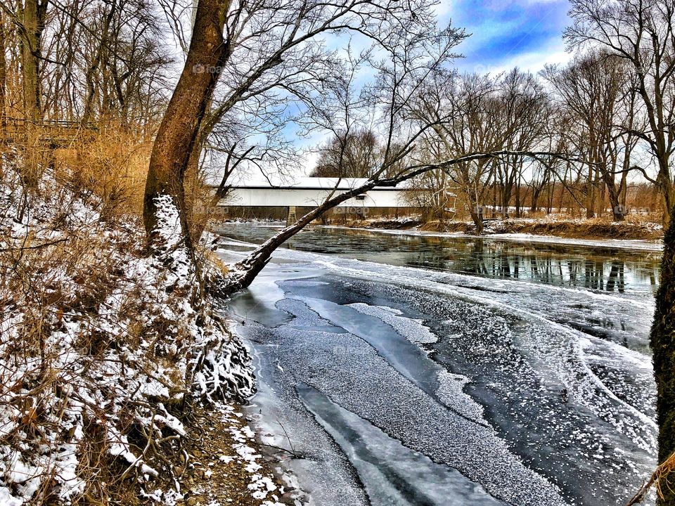 Old Indiana covered bridge in winter. 