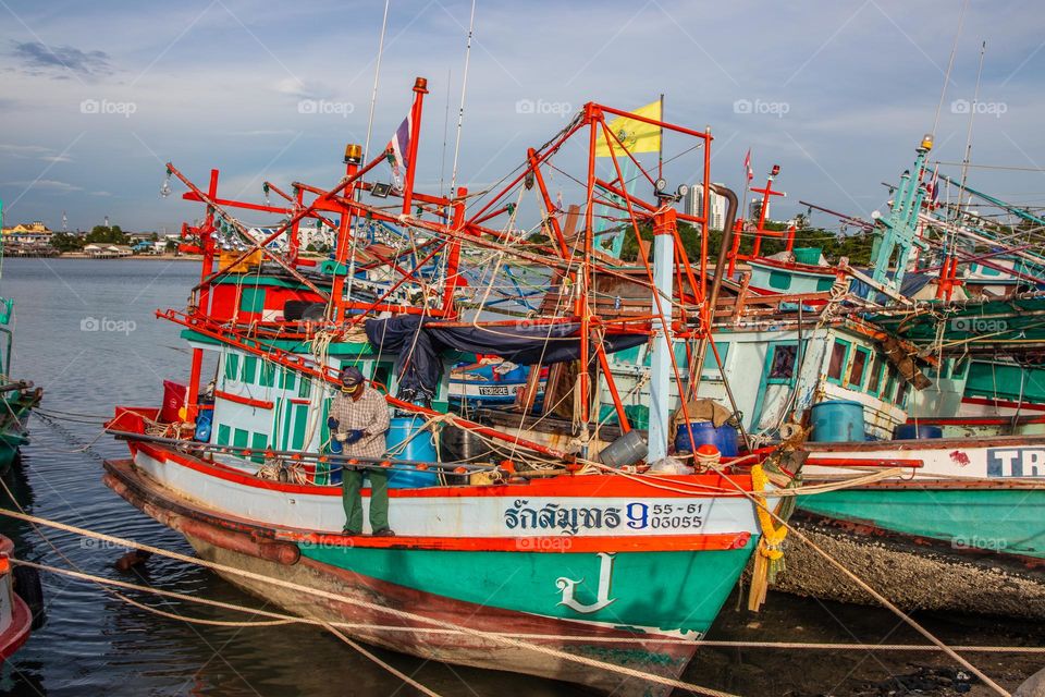 Thai Fisherman's boats at a fishing Pier in Thailand Southeast Asia