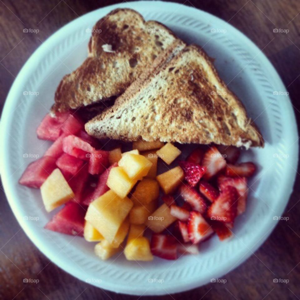 Low fat cheese toast and fruits 