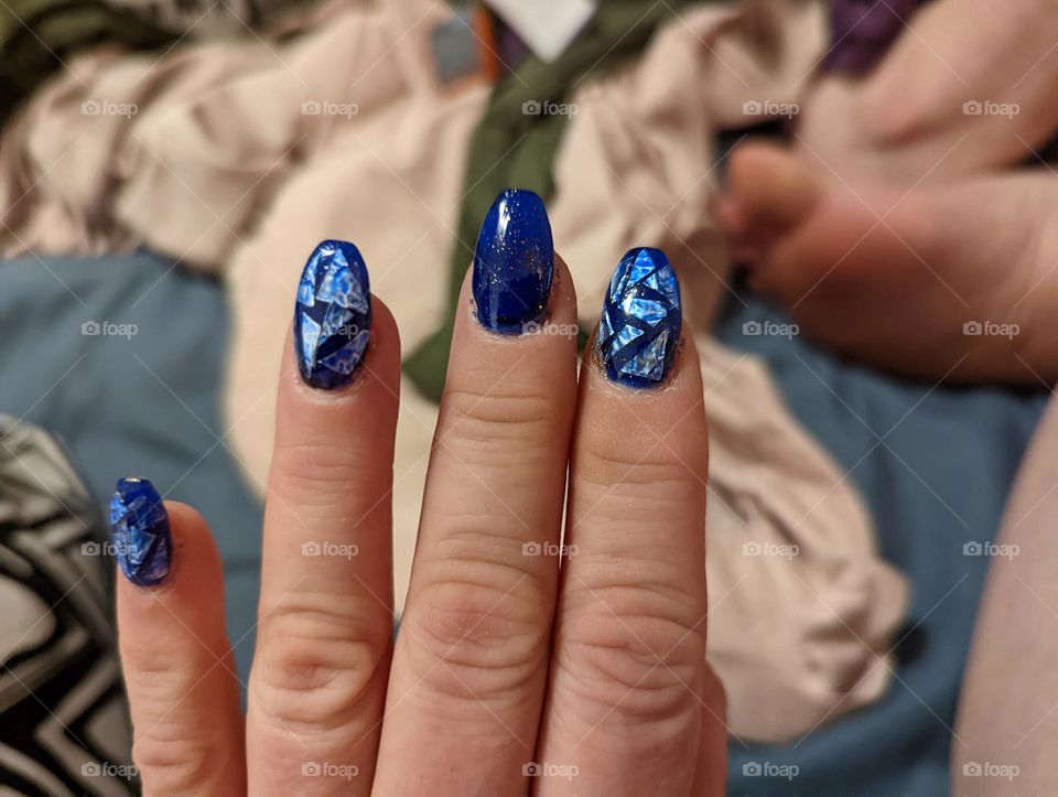 cut up tin foil with blue Frozen nails