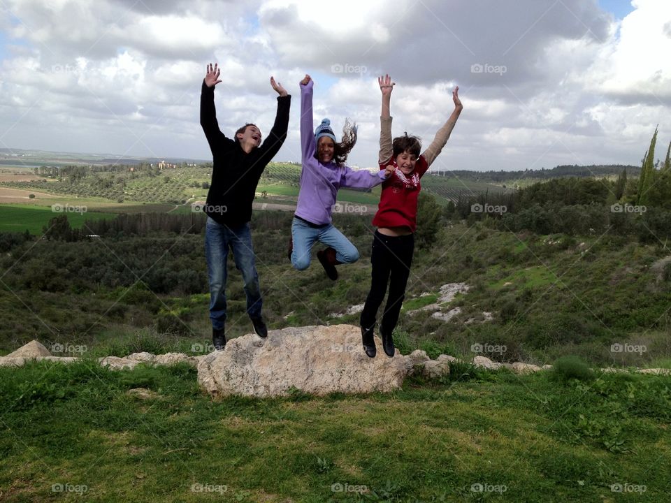 Three Kids Jumping in a Funny Way