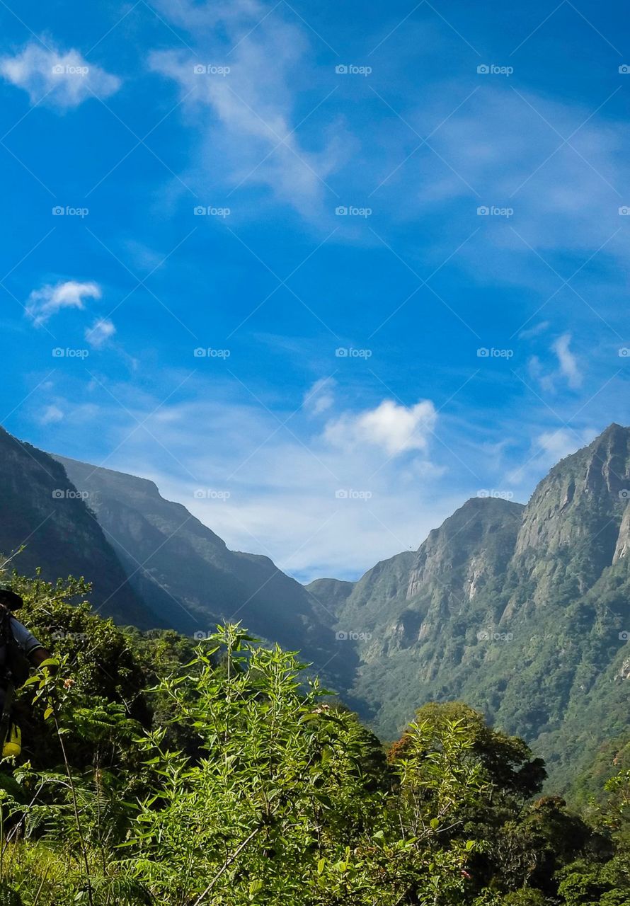 The view from the jungle.# mountain range and the blue sky tying to tell us a story. # what a beauty 💙