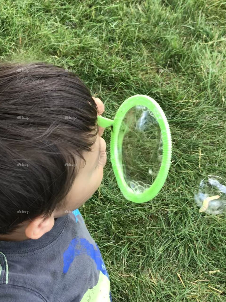 Child blowing bubbles