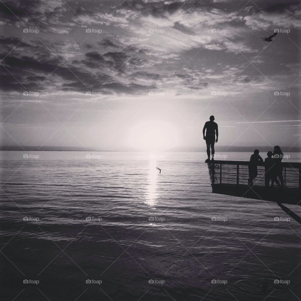 Scenic view of sea near cityscape