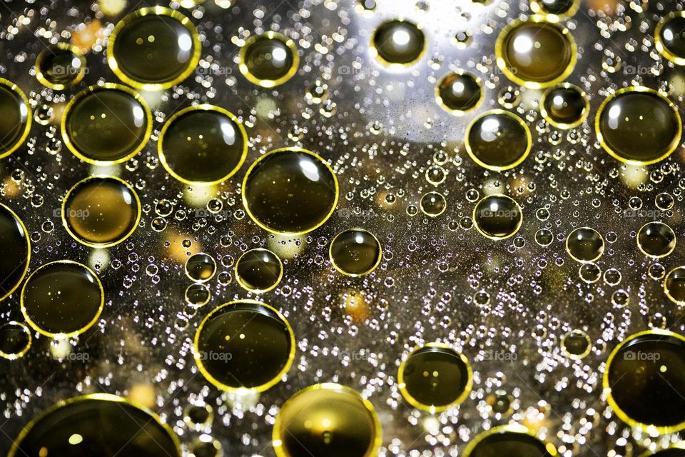 Golden oil Bubbles Close Up background amazing colours droplets of life in black texture macro look summer mood positive vibes wonderful day hustling daydreaming
