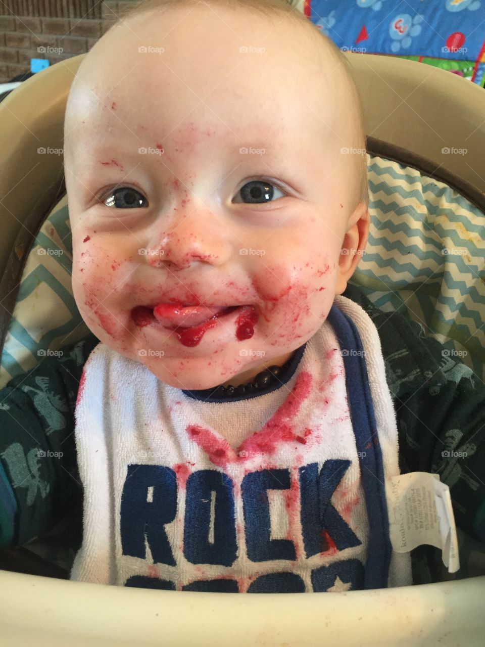 My beautiful son eating his cooked beets and blueberries and loving it!! He absolutely loves his solids and beets are his favorite. Cutie pie giving mom a cute tongue smile.