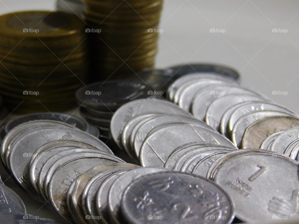 Indian Currency in Rupees - Coins are stacked with definite arrangement.