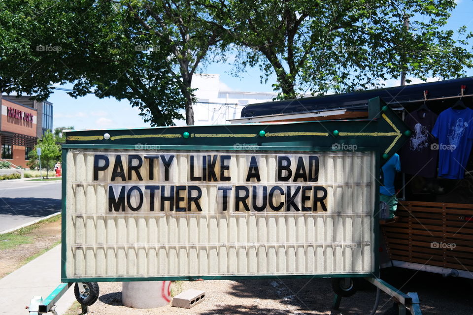 party like a bad mother trucker. sign board at the entrance of truck yard, dallas, TX 