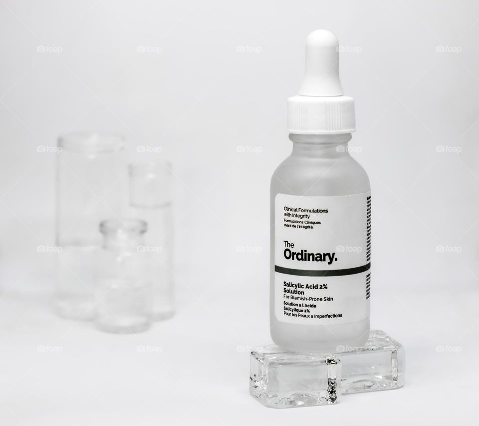 The Ordinary Sallcylic Acid 2% Solution displayed on glass cubes in a clinical setting