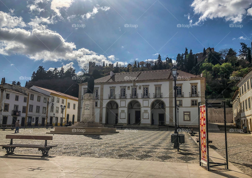 A lone figure crosses the usually busy Praça da República at the start of the coronavirus outbreak in March 2020. Tomar, Portugal