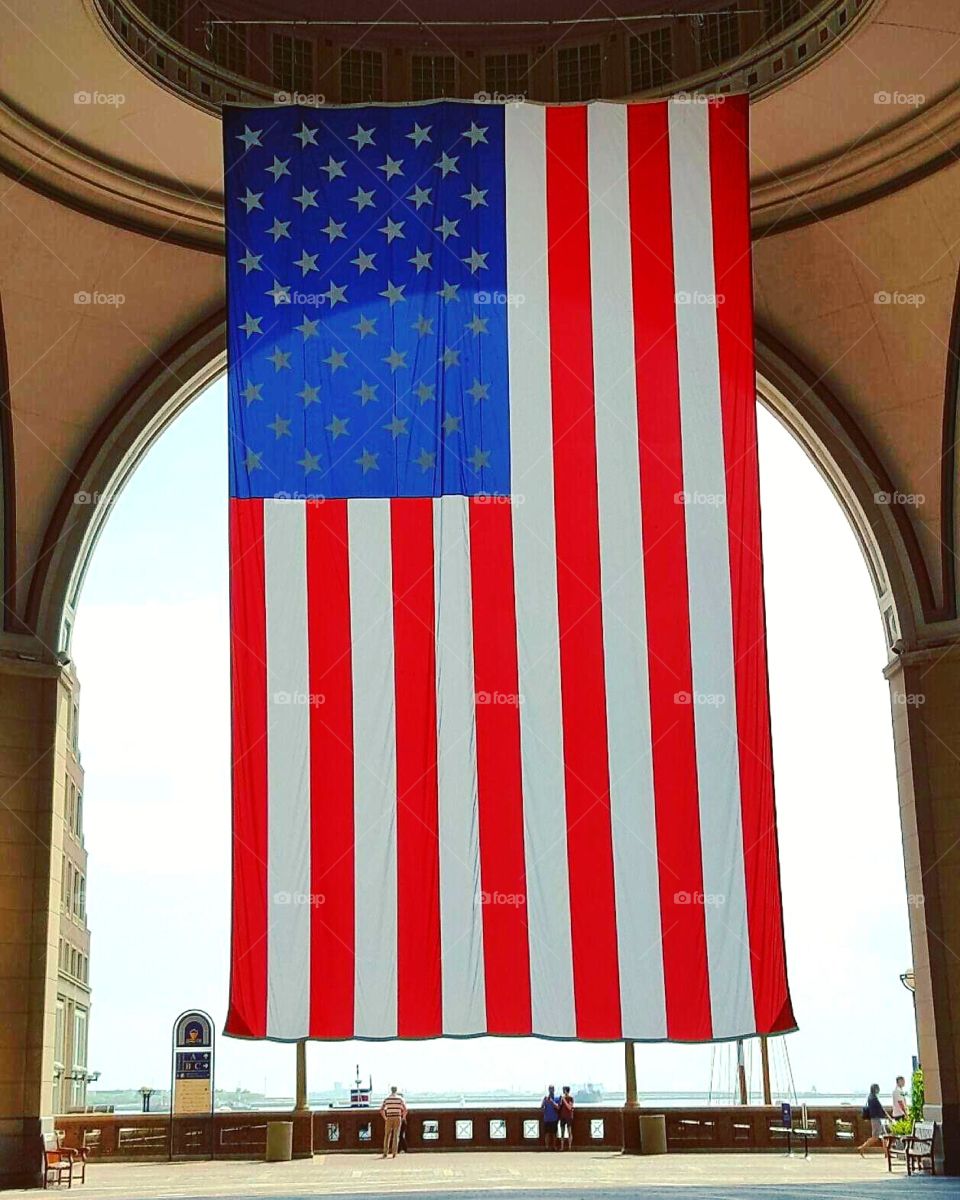 Giant American flag hanging at Boston Harbor