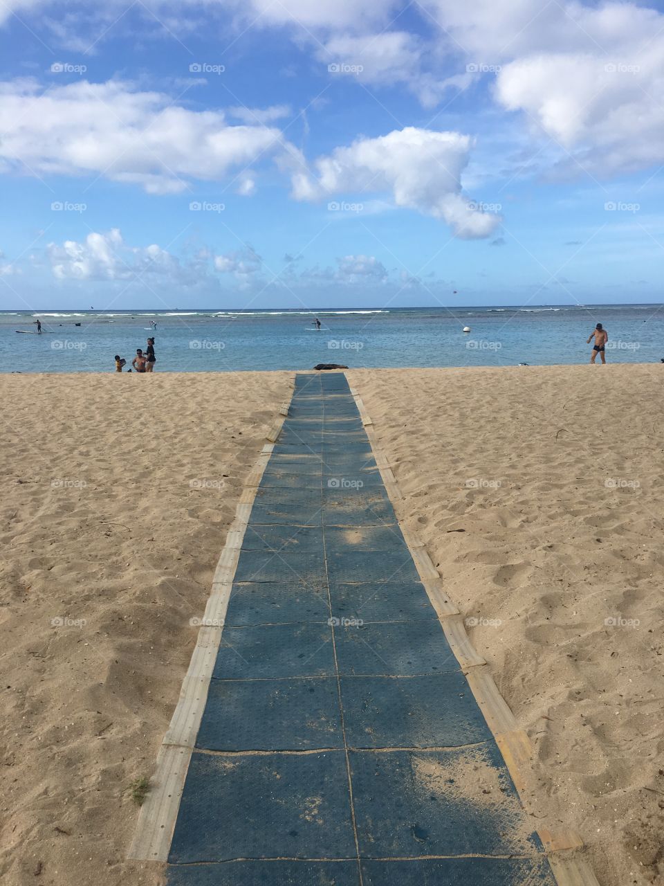 Blue walkway into a beach