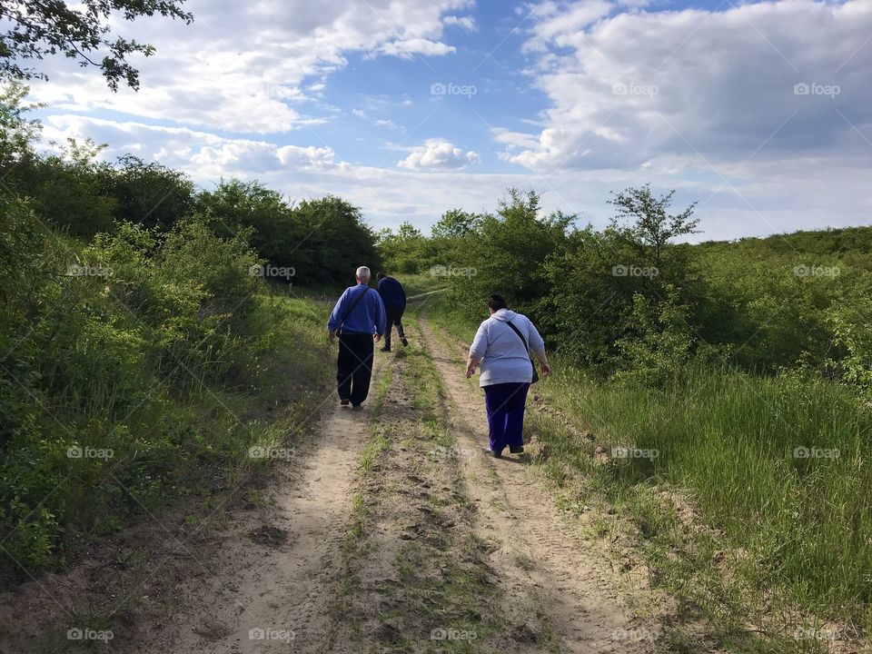 A happy little family is going for a walk in nature after long months of being in quarantine.