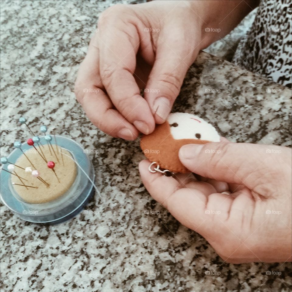Human hand making keychain