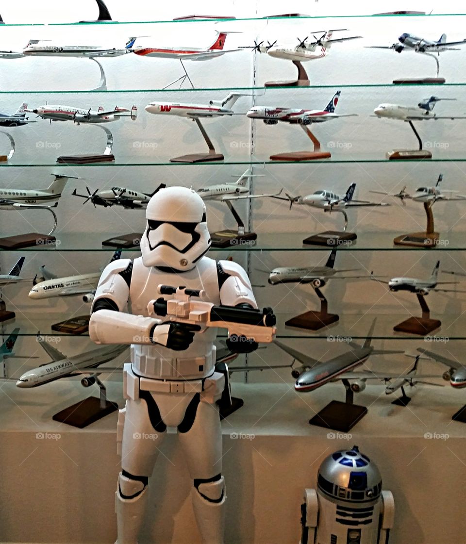 "Step away from the planes!"  Storm Trooper guarding model planes.