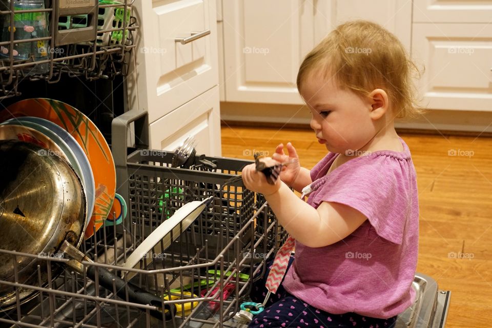 Little Girl Helping With Household Chores