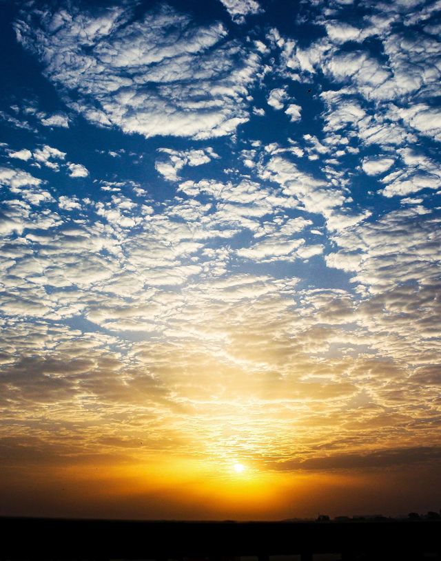Sunrise with cloudy sky