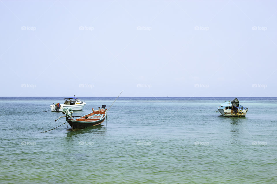 Fishing boats parked on the Beach at Haad salad , koh Phangan, Surat Thani in Thailand.