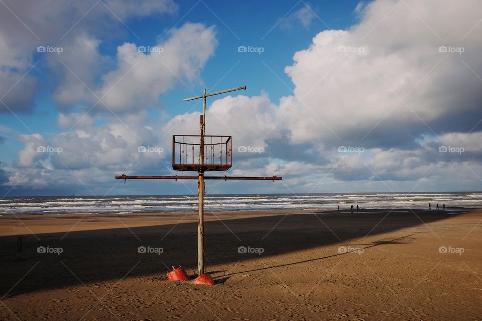 Beach, near the sea, big clouds, shadows on beach, coastline