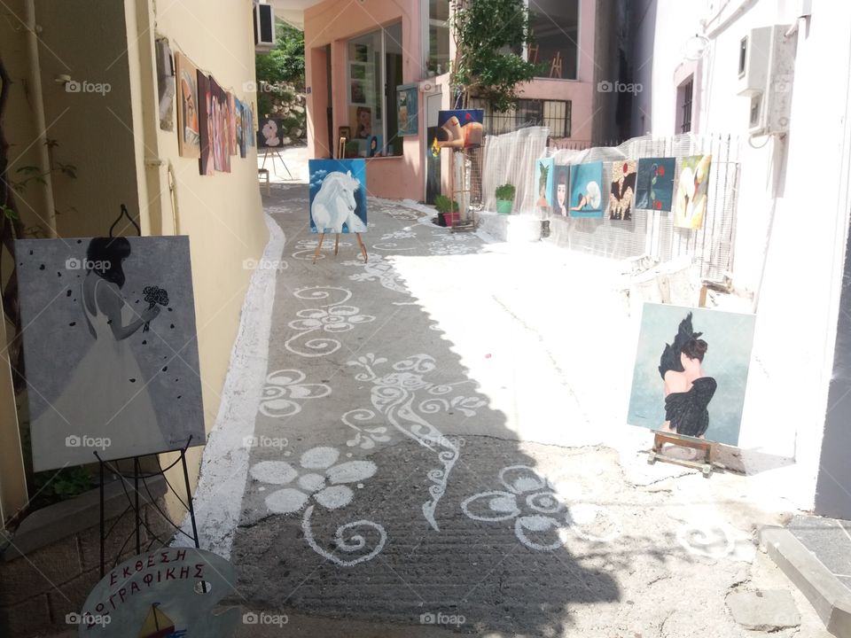 paintings on a Greek Island street