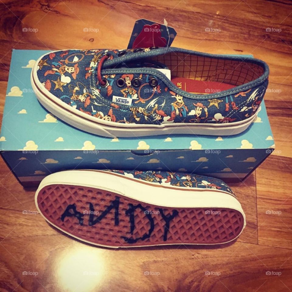 Toy story vans ‘ with the word Andy on the bottom of the shoe 