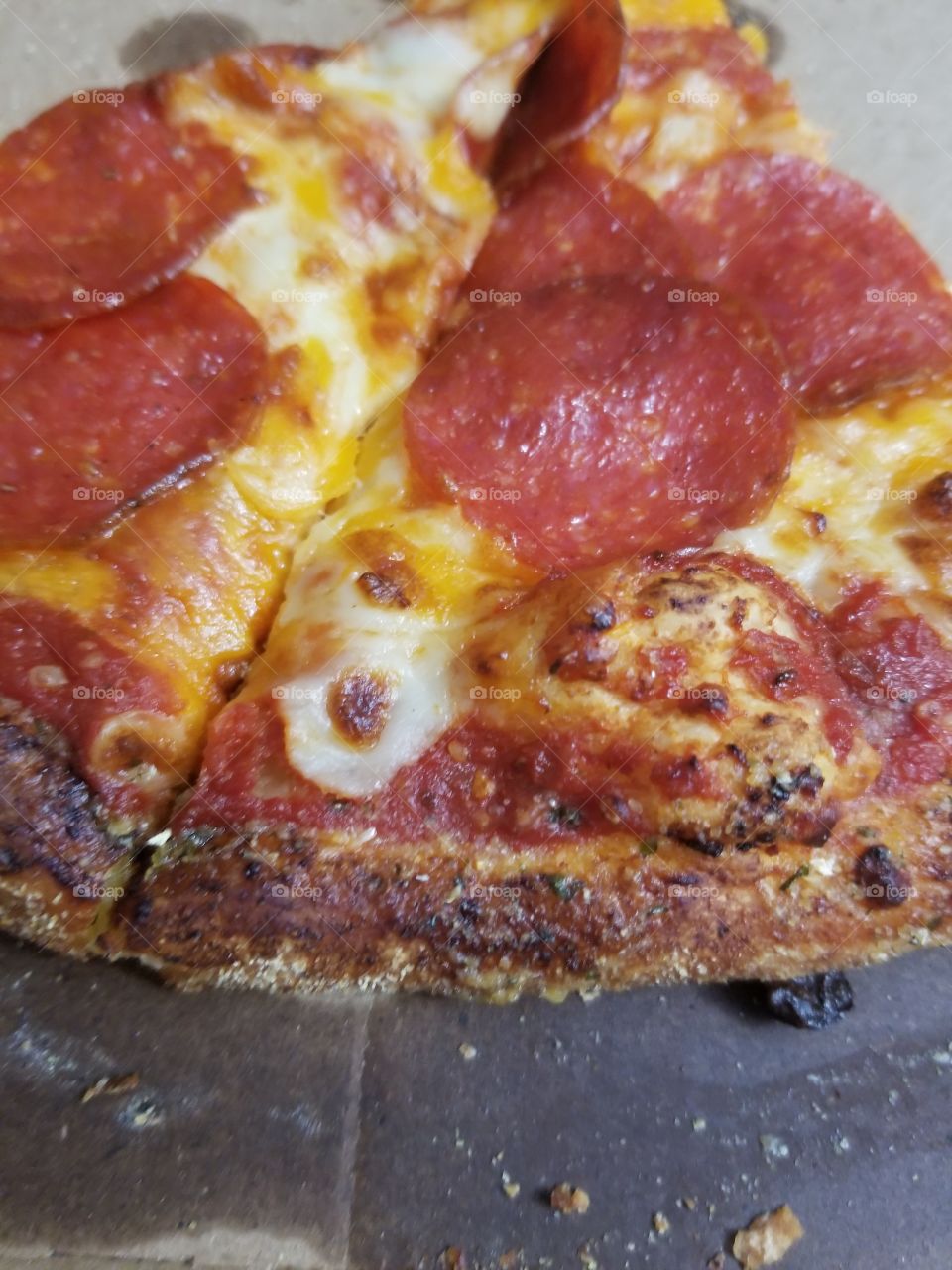 Two slices of pepperoni pizza