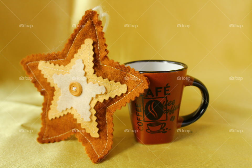 textile star and coffee cup