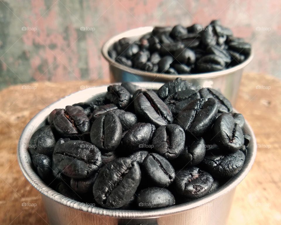 container with roasted coffee beans