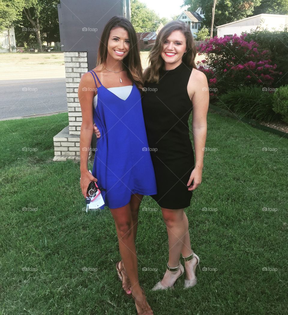 Two woman standing on park