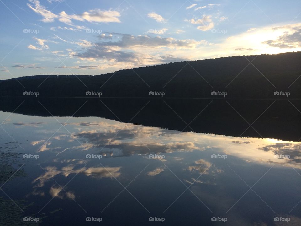 Mirrored. There was a beautiful sunset as we enjoyed a tranquil afternoon at the lake.  The lake was so still it mirrored the sky.