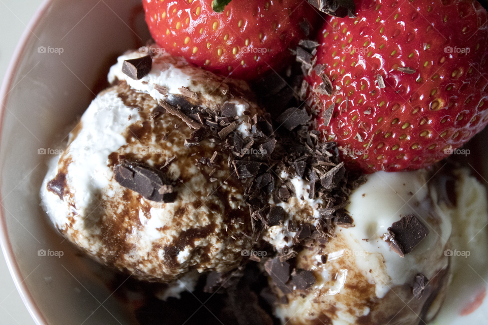Chocolate ice cream with strawberries