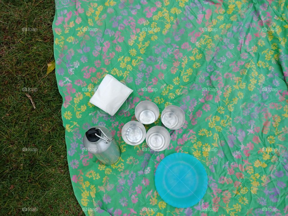 Setting up for a picnic, waiting for food
