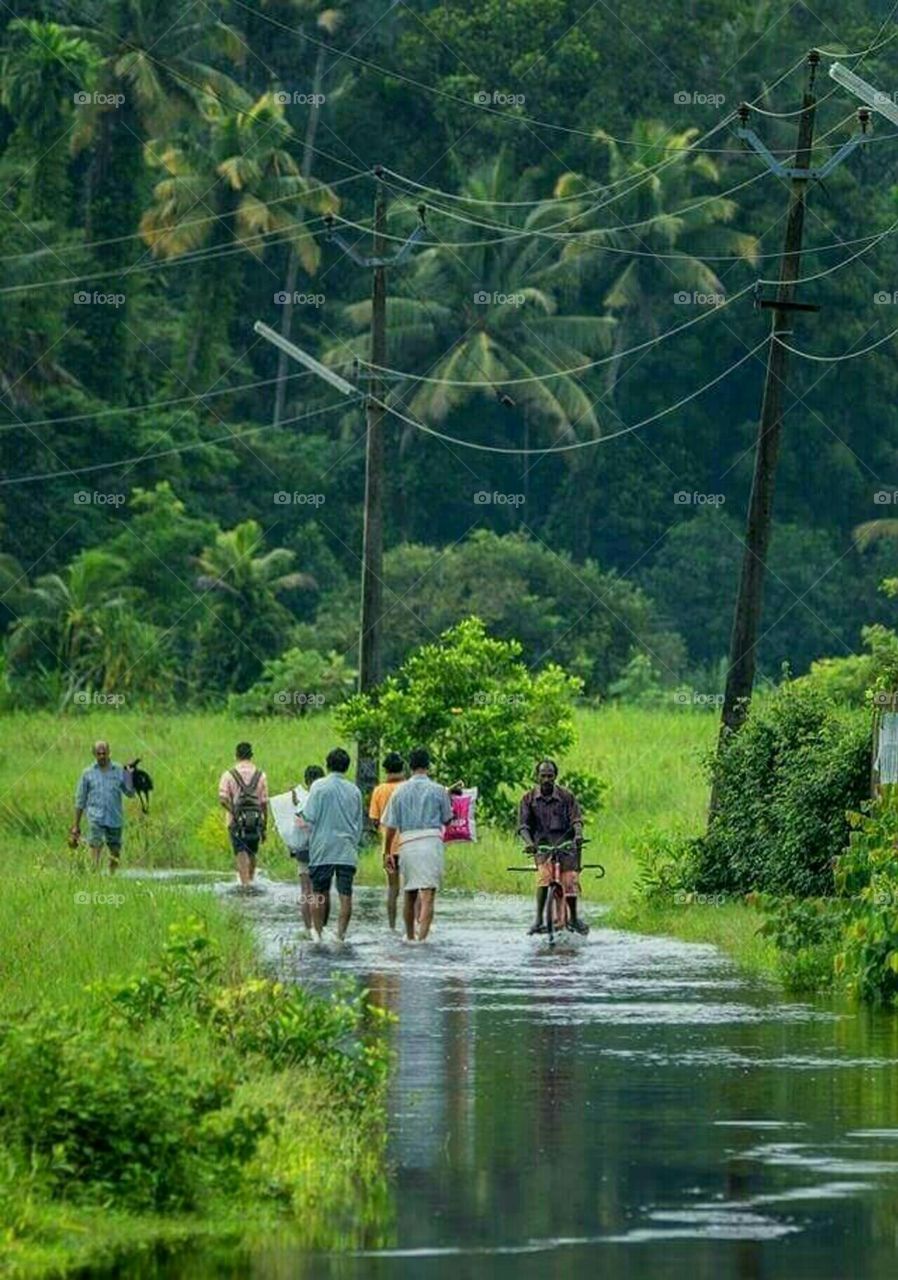Rain Or Flood Cannot Stop People's Daily Activities