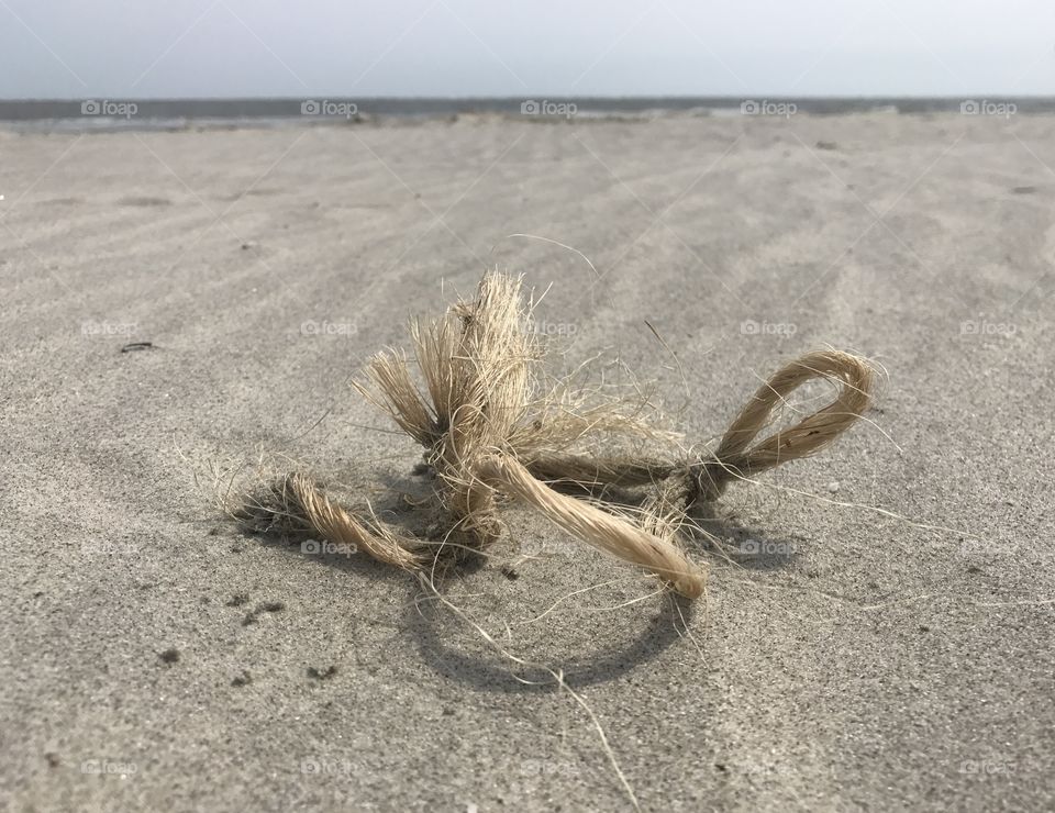 Tied knots on the sand