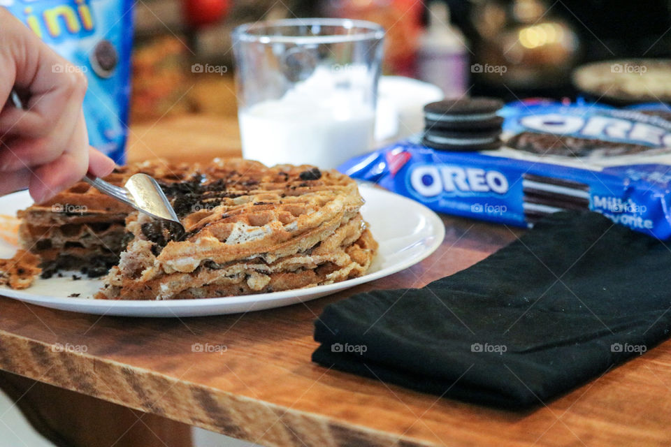 Delicious warm Oreo cookie waffles and milk.