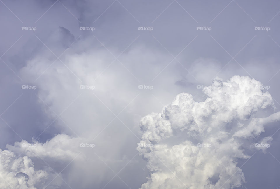 The beauty of the sky with clouds and the sun in summer.