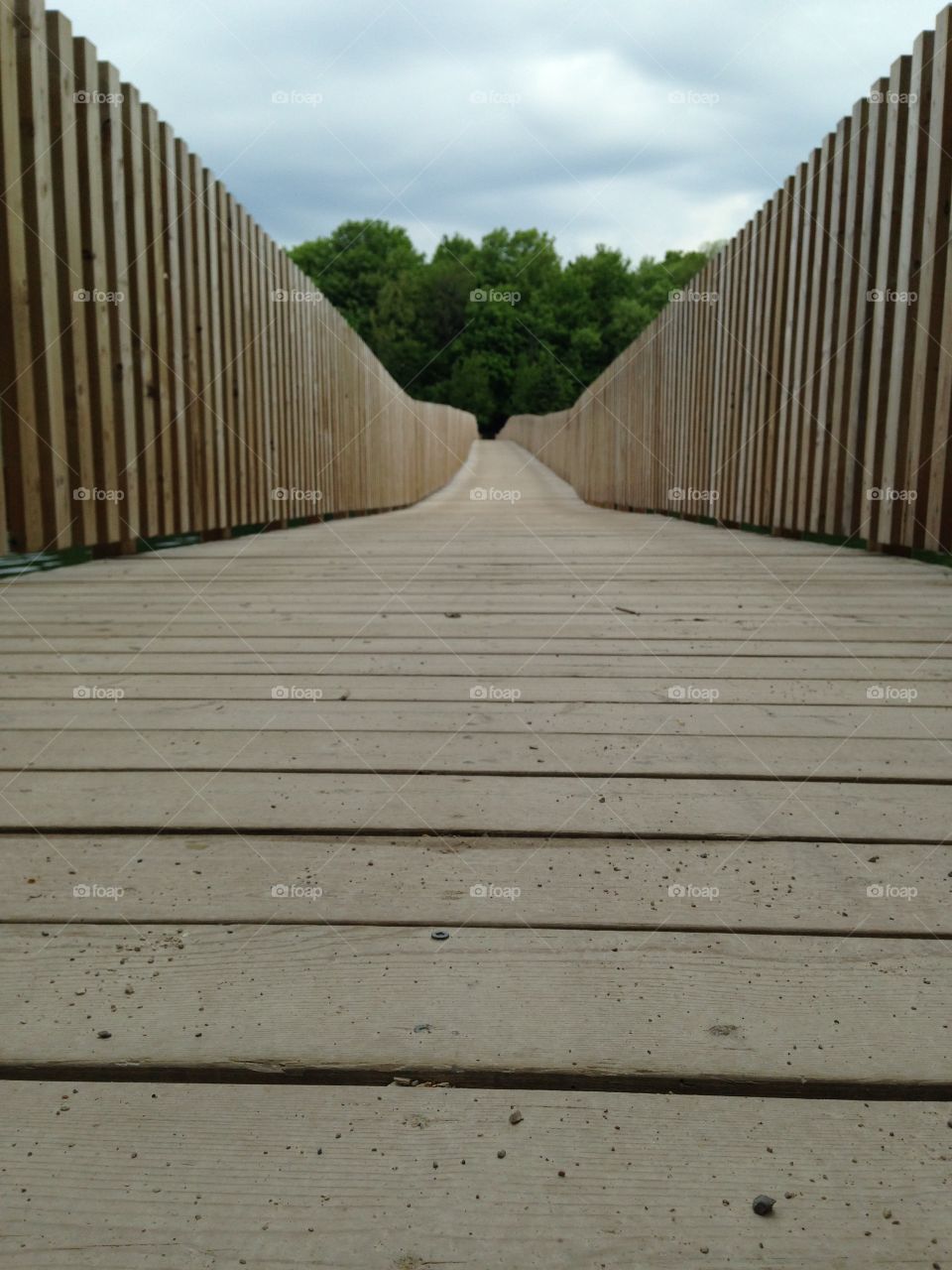 Bridge. Long wooden bridge taken from ground's eye view
