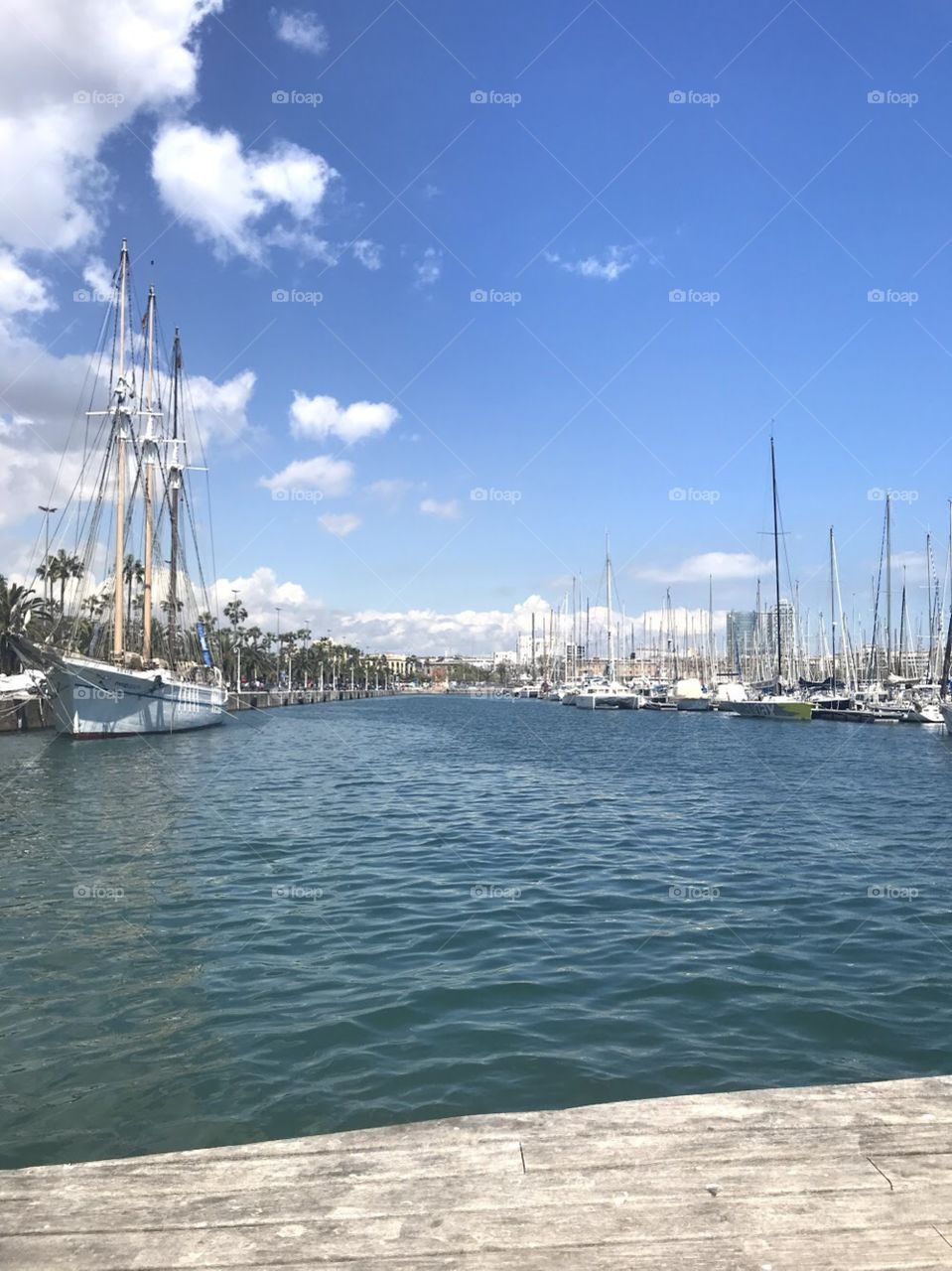 Boat dock in Spain on water with blue sky 