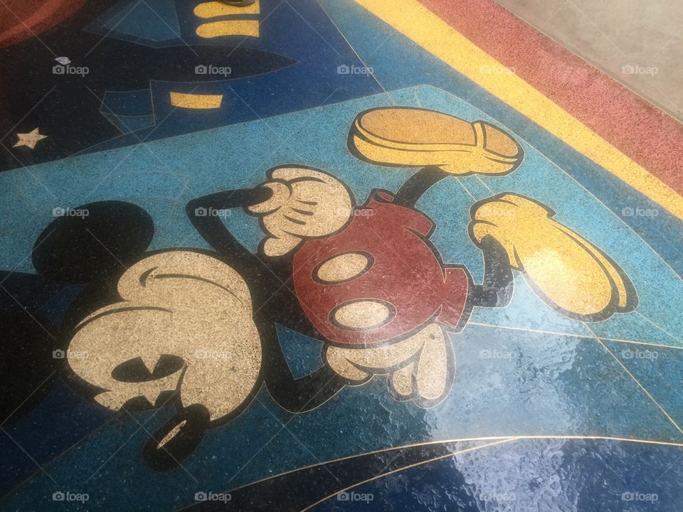 Mickey Mouse tiles at the entrance to the Disney Store in Chicago. 
